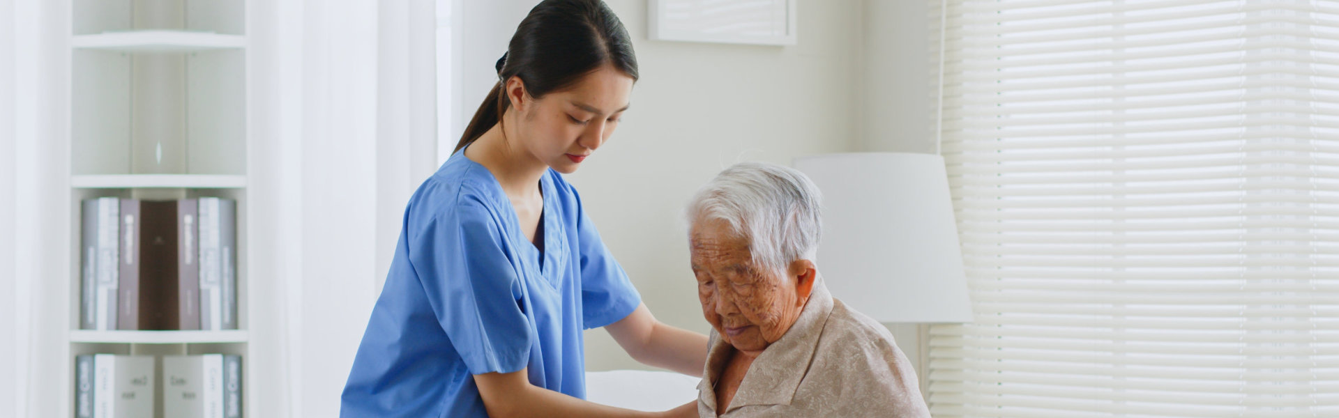 woman helps a senior woman