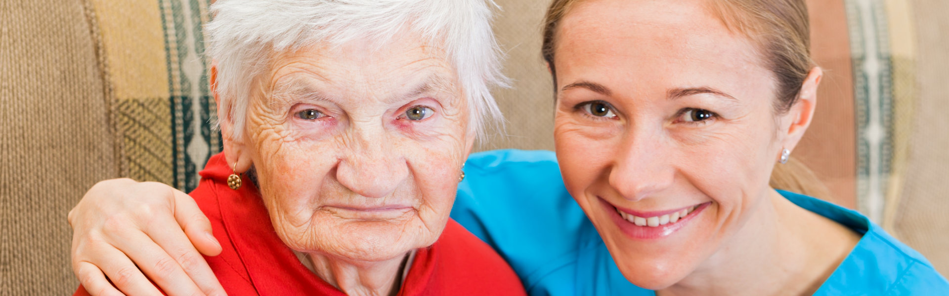 elderly woman and a woman smiling